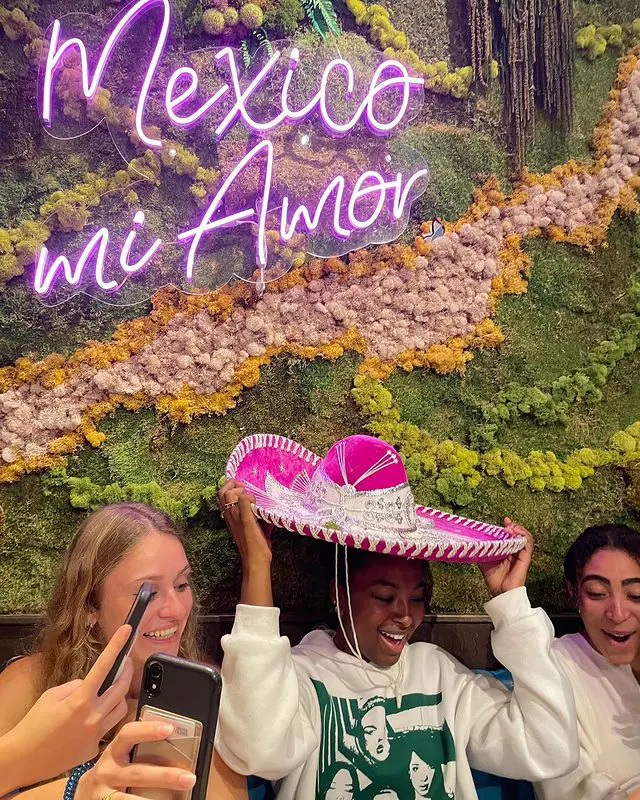Valery with her friends having a good time in a Mexican Restaurant