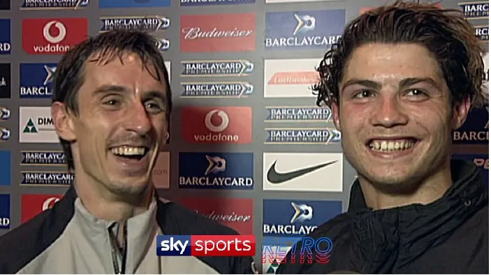 Manchester United's Ronaldo and Gary Neville laughing during an interview with Sky Sports in 2004