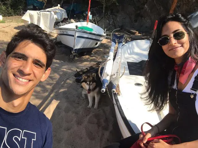 The couple were seen on a beach on 2017 with their dog and boats 
