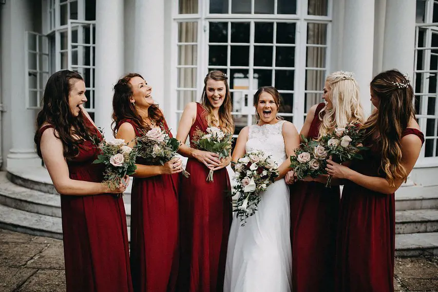 Leanne's bridesmaid were all dress in a gorgeous deep red gown that looked stunning against her white gown.