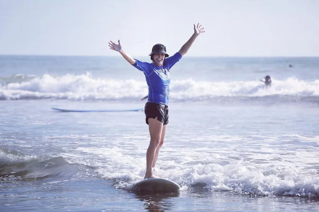 Julie enjoys surfing during her trip to Costa Rica