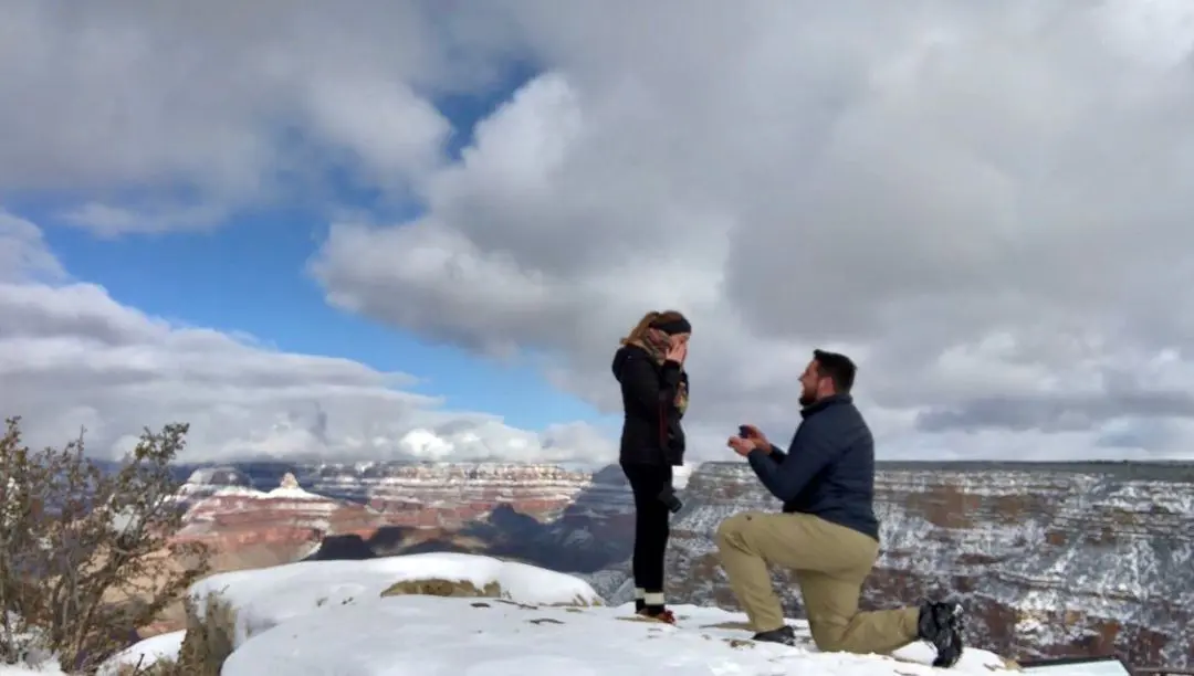 Greg made a surprise proposal to his girlfriend during their vacation trip.