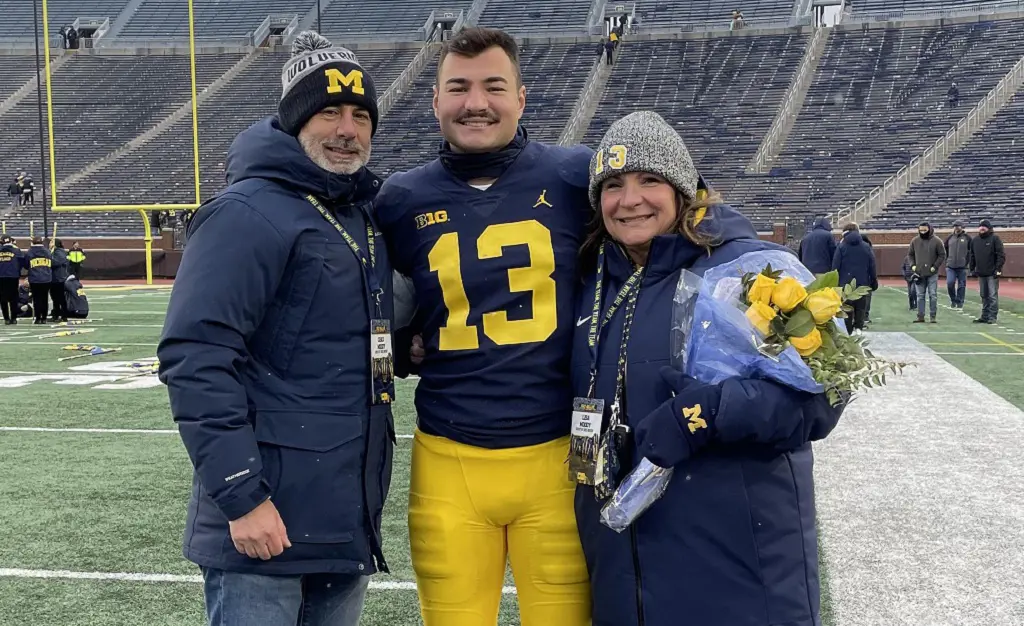 Jake Moody with his father and mother during his game on November 20, 2022. 