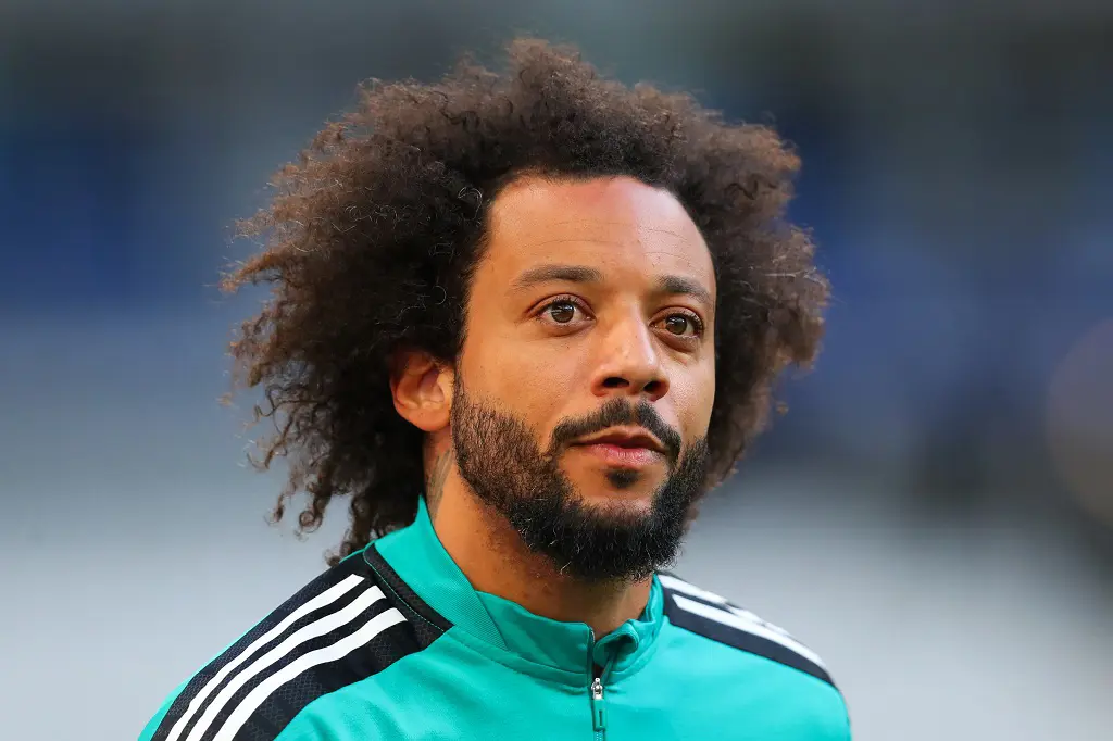 Marcelo, a Brazilian footballer, wore the number 12 jersey for Olympiacos, which competed in the Super League of Greece. 