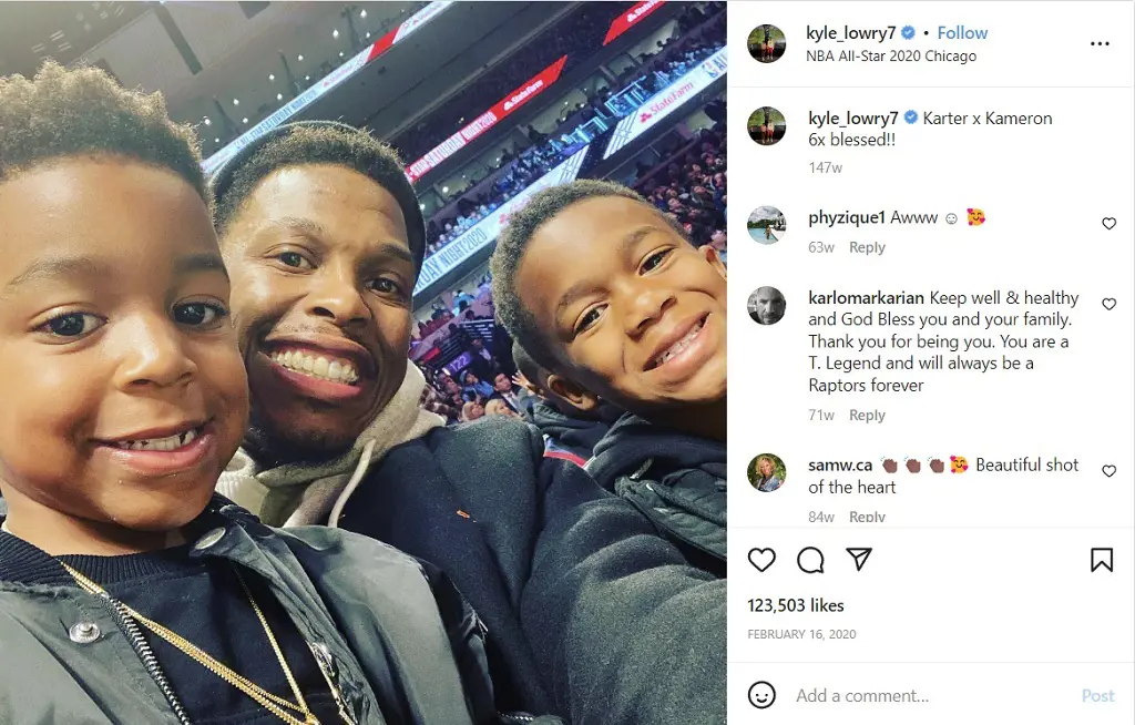 Kyle with his sons Karter and Kameron at an NBA game.
