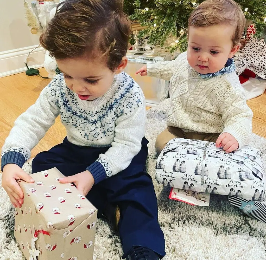 Luca and Romeo opening their Christmas present on December 25, 2021
