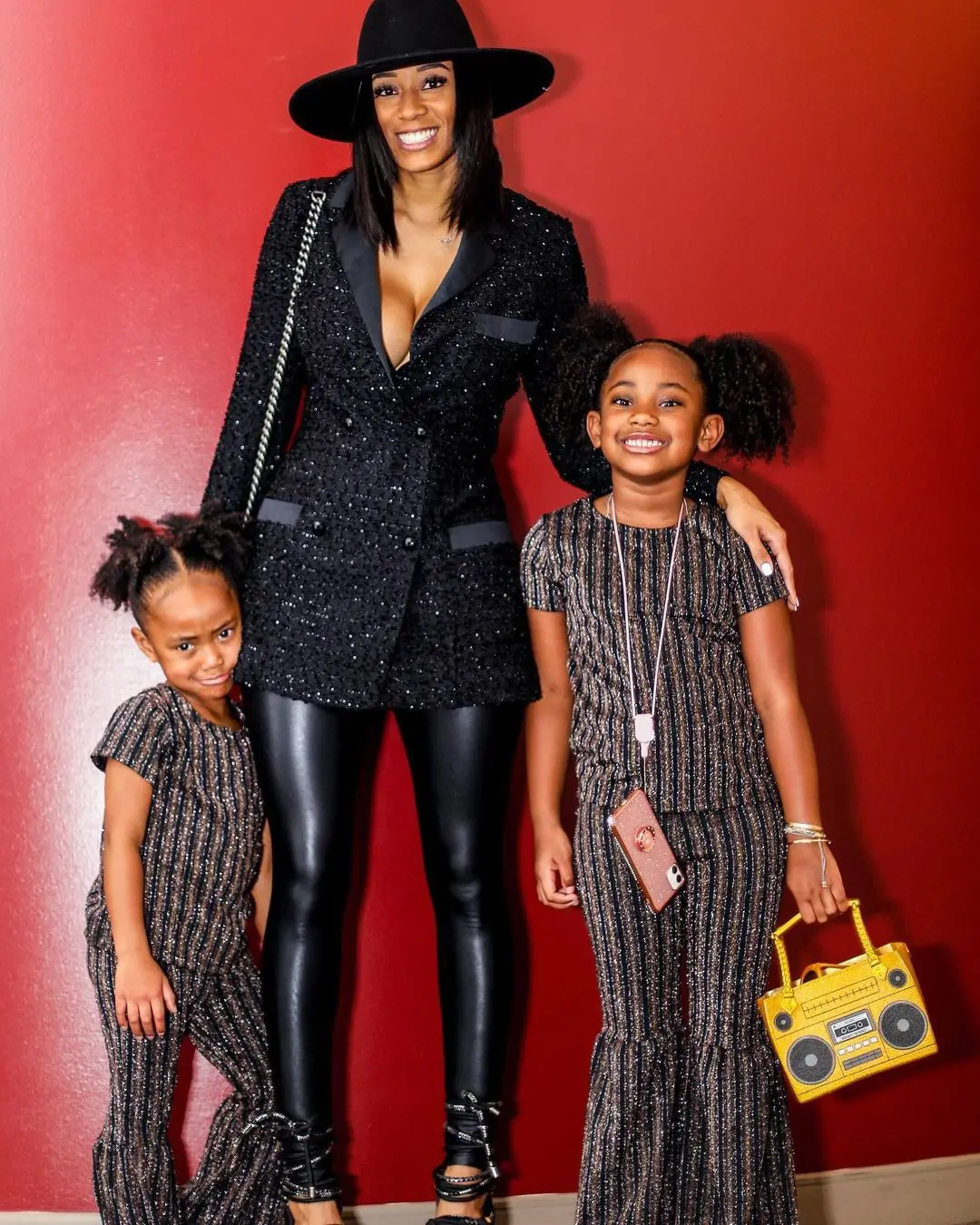 Kiara Morrison poses for photos with her two baby girls