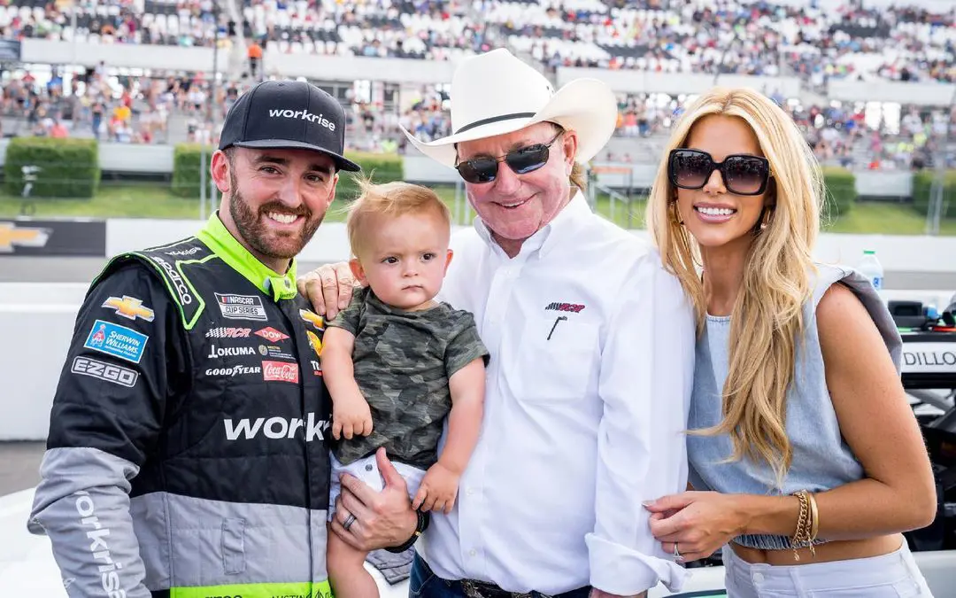 Austin with his son Ace, grandfather Richard Childress, and partner Whitney.