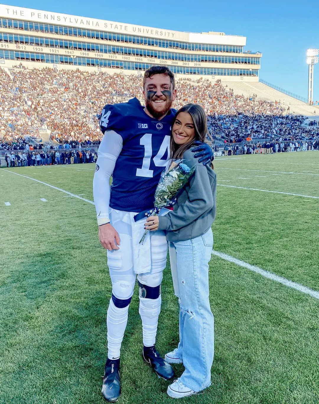 Sean with her partner Juliana hugging each other after the game at Beaver Stadium, State College, PA in November 2022