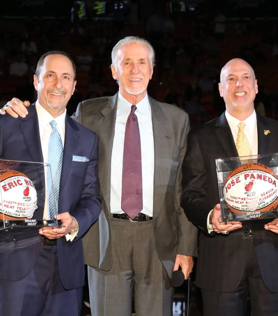 Life-long Miami Heat announcers Reid (left) and Paneda (right) being honored by the team president Pat Riley (center) for calling 2000 games each in March 2016.