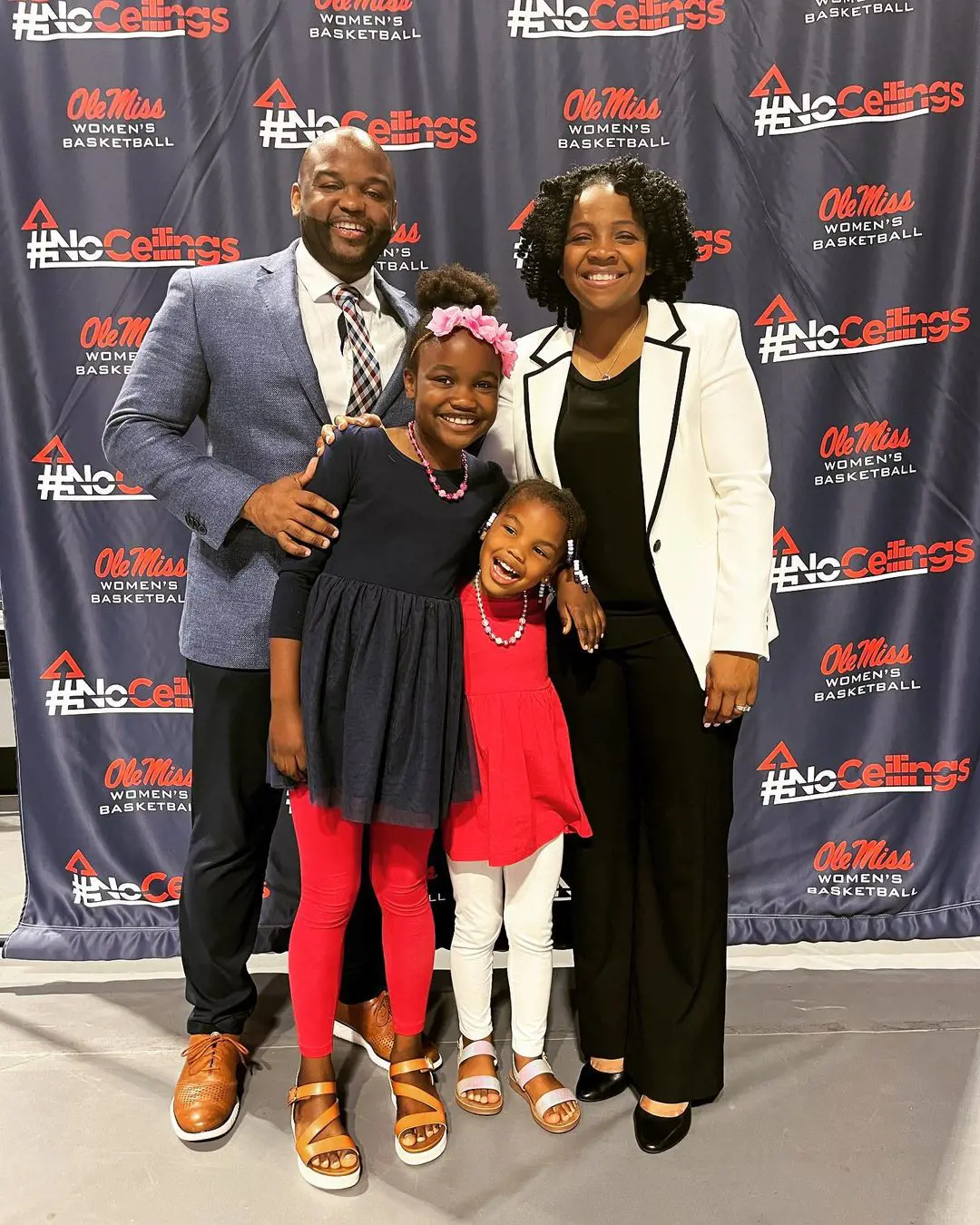 The Rebels coach (right) with her hubby and little ones at The University of Mississippi. 