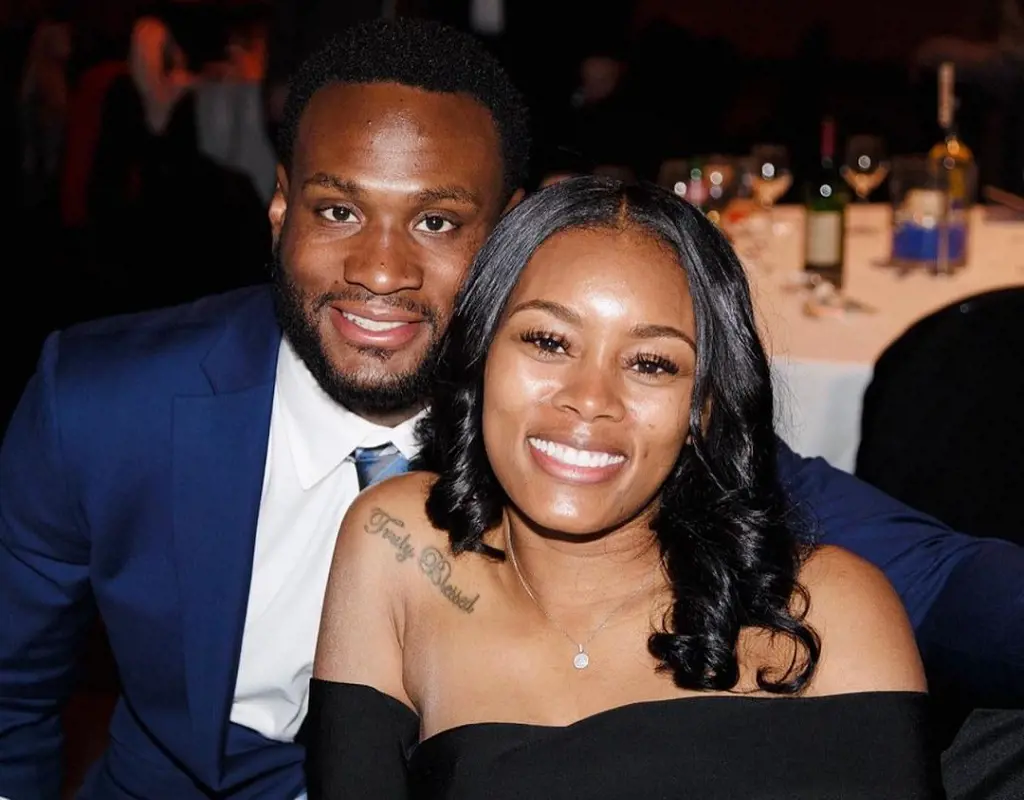 The NFL running back is married to his Navy officer partner.