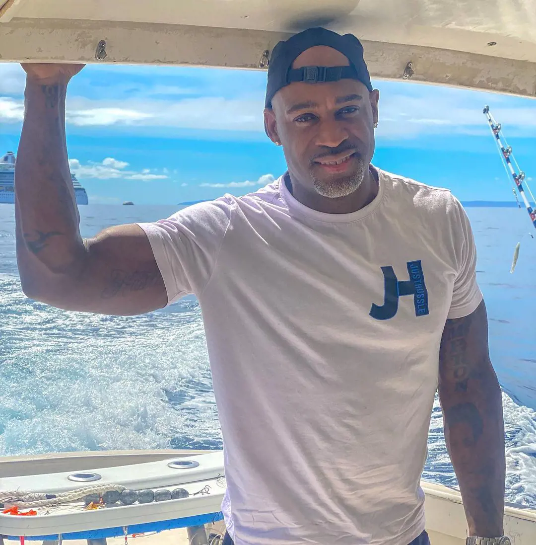 Jelani wearing Just Hussle T-shirt and enjoying fishing at Maui Hawaii on October 7, 2022. 