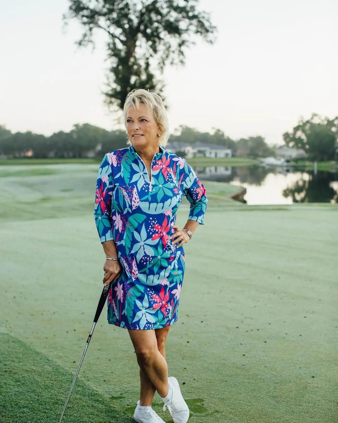 Dottie Pepper strikes a pose with a golf club, January 2022