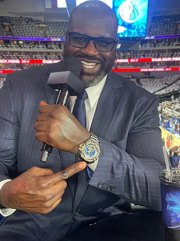 Shaquille showing off his Swiss made water resistant watch. 