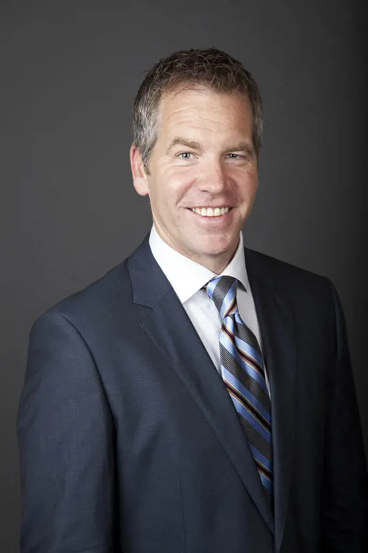 Paul Burmeister wears a dark blue suit for his official NBC picture.