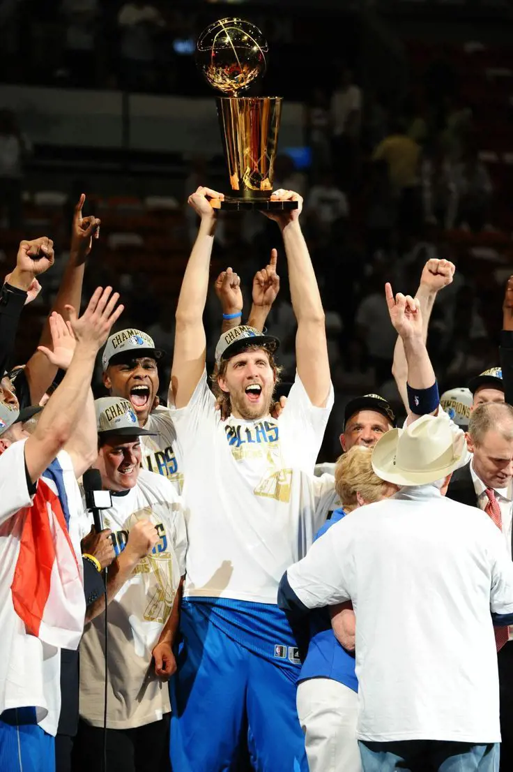 Nowitzki celebrates the 2011 title triumph with teammates.