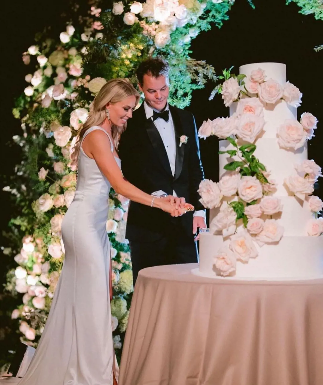 The couple cutting their wedding cake at Lake Como, Italy, on their wedding.