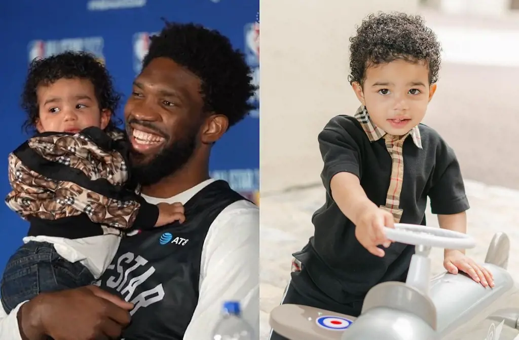 Joel holding Arthur, 2, during a press conference in February 2022