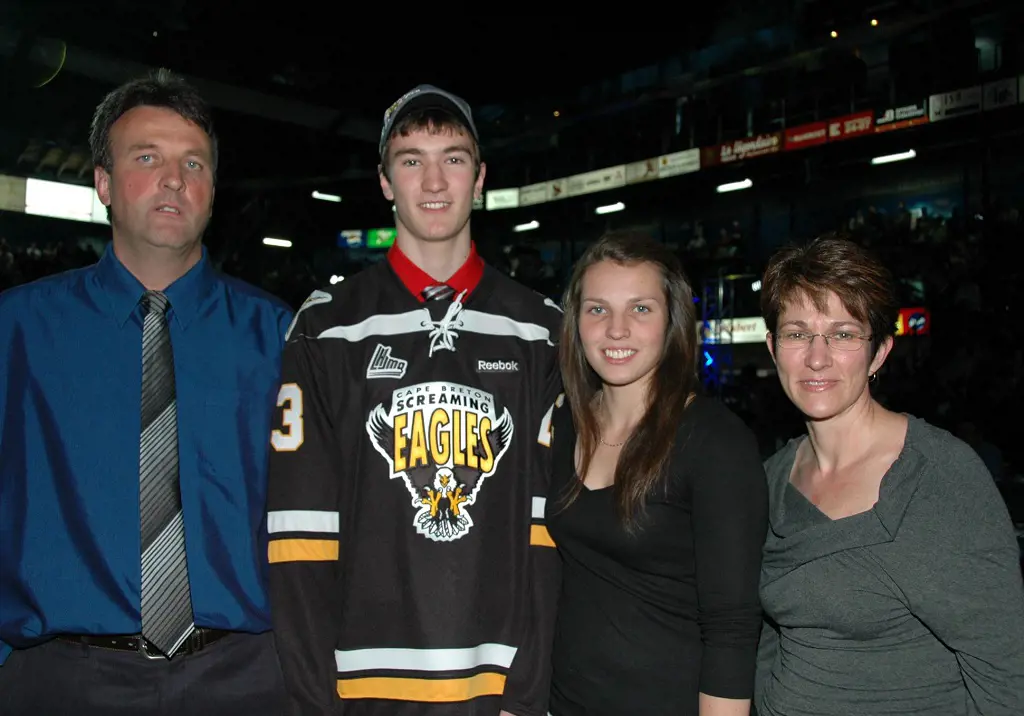 Ice hockey centre Nicolas with his family during his 2013 QMJHL Draft