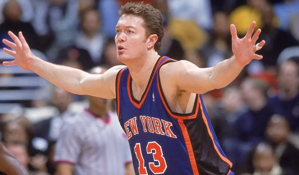 Luc playing basketball for the New York Knicks.