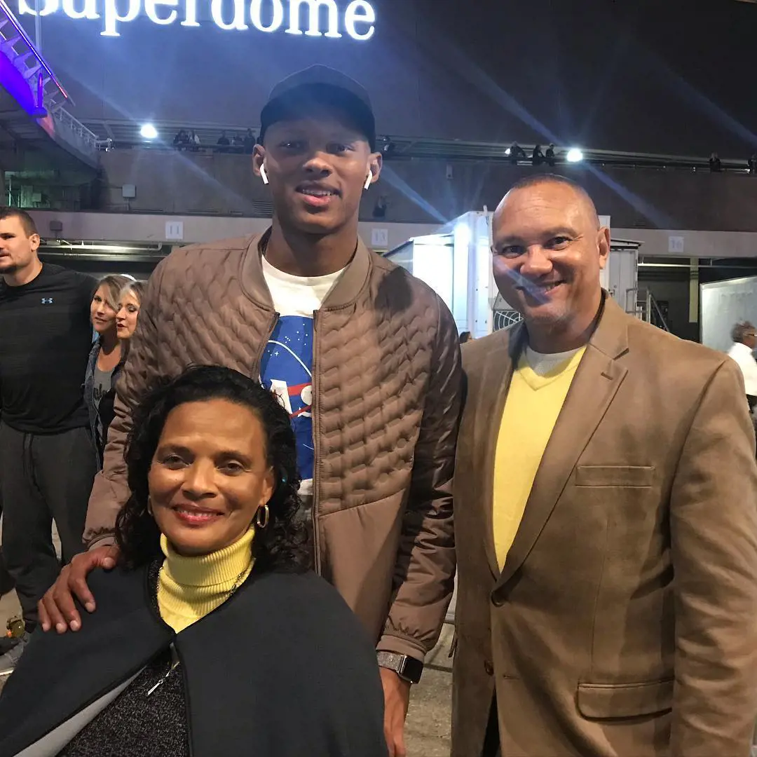 Joshua with his mother and father. 
