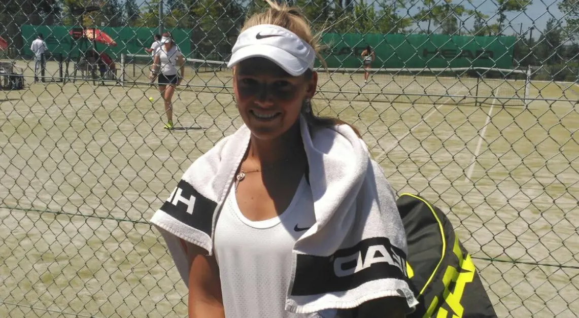 Anastasija at the tennis court during her game.