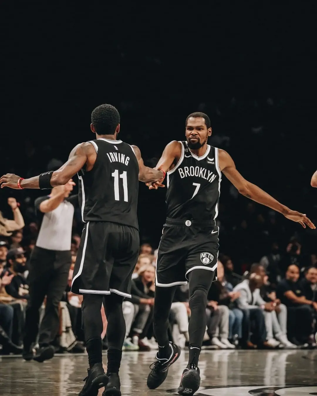 Brooklyn Nets players Kyrie Irving (left) and Kevin Durant (right) in a game on January 2023 