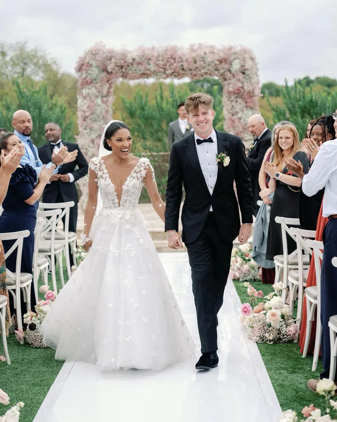 Hunter Woodhall walked down the aisle with Tara Davis in October 2022.