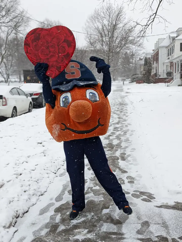 Otto the Orange enjoying the snow holding heart shape on February 14, 2022. 