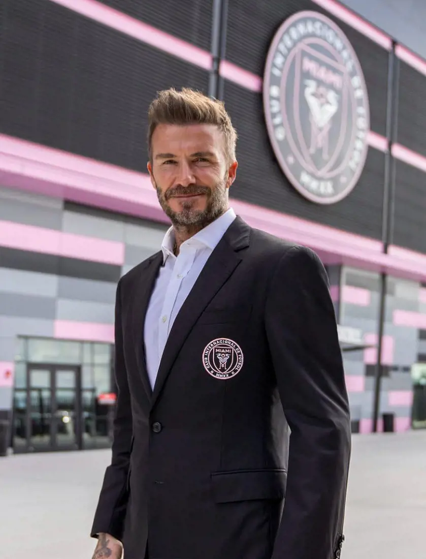 Beckham poses in front of Inter Miami Stadium in February 2023