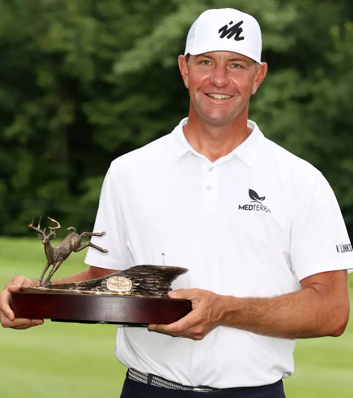 Lucas Glover holds his 2021 John Deere Classic trophy after the triumph.
