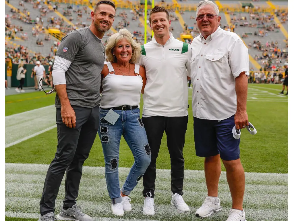 Lafleur with his mother, father, and brother at a stadium during a Jets-Packers game in October 2021