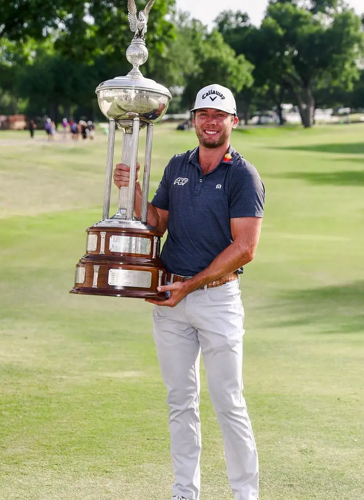 Sam holding the champion trophy at Colonial on May 30, 2022