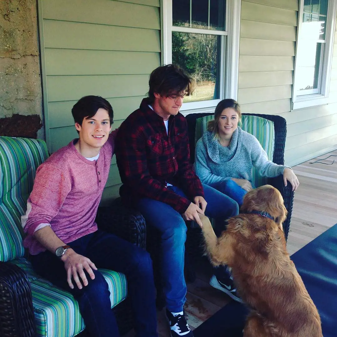 Dylan having fun with his pet and siblings.