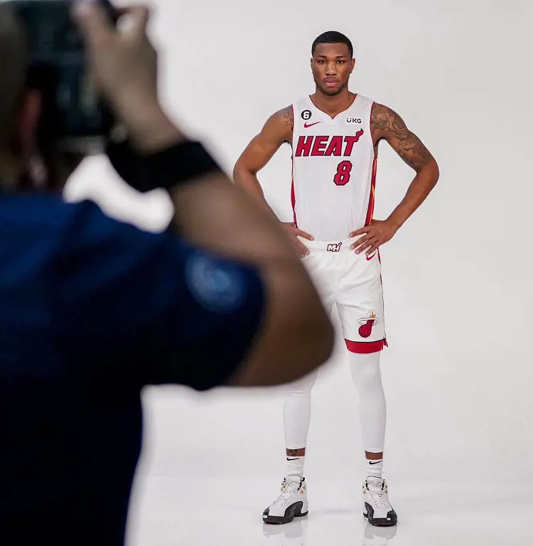 Jamal's photoshoot wearing Miami Heat jersey after signing with the team in 2022. 