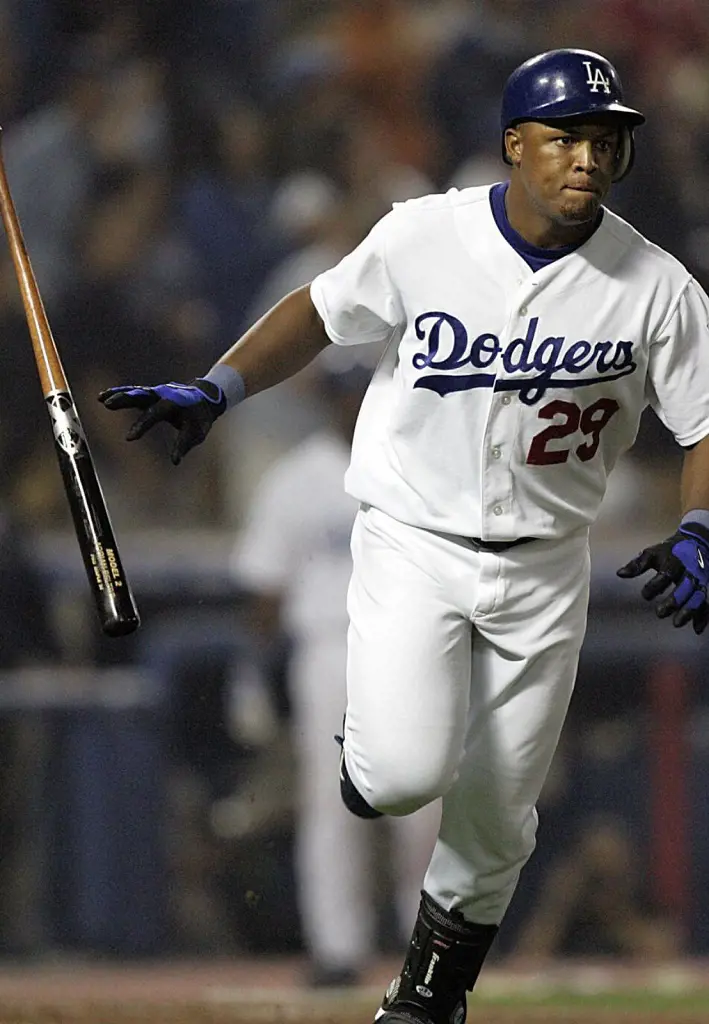 Adrian Beltre flips the bat after hitting a grand slam against the Colorado Rockies on Sept. 27, 2004