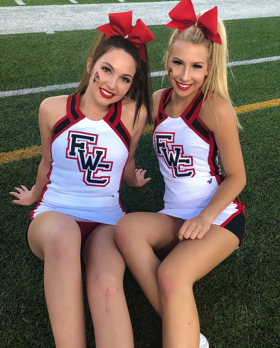McKenna with her teammate donning cheerleader custom in the ground of Fort Worth Christian School in September 2018