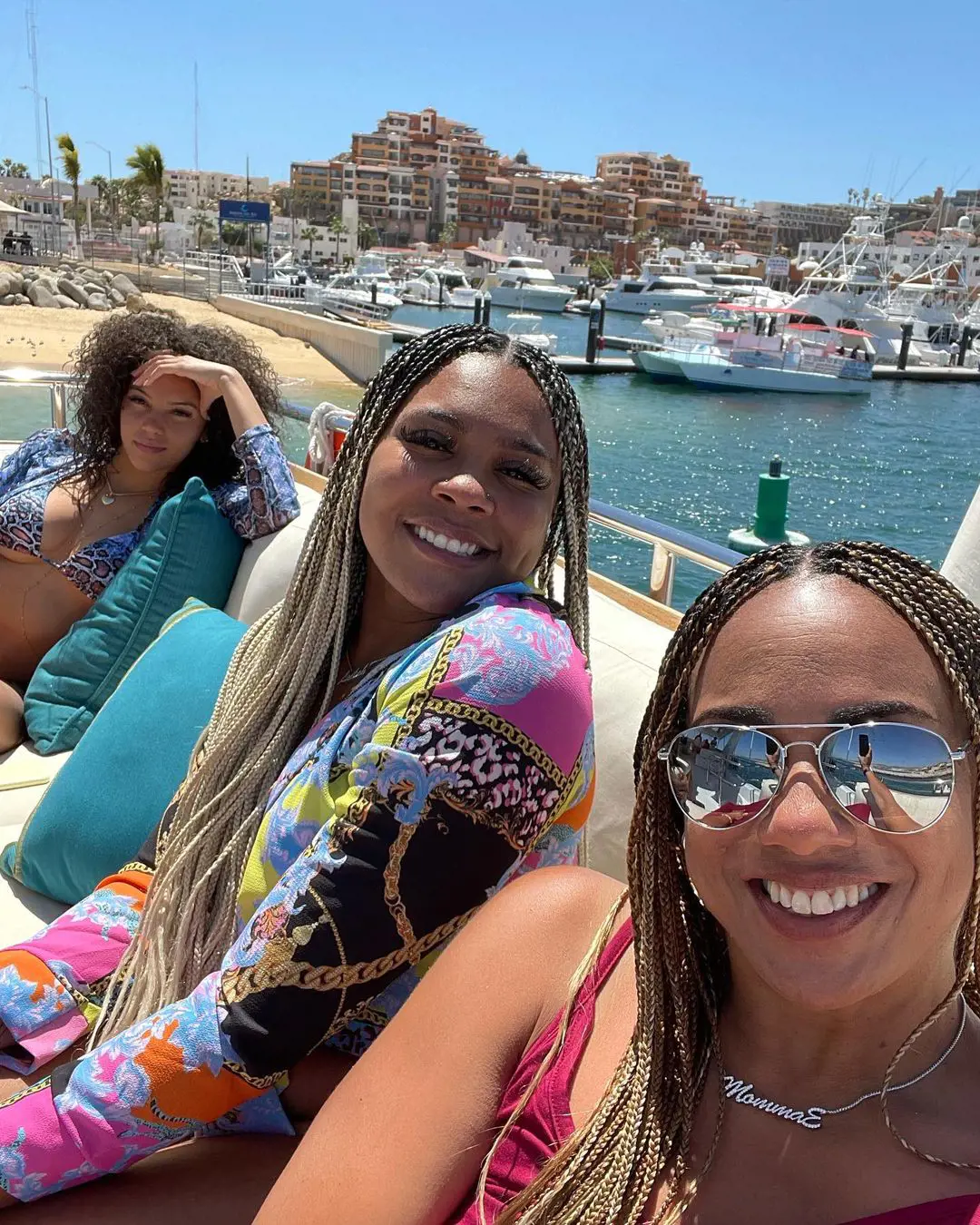 Halle (left) with Zeke's sister (middle) and mother (right) while vacationing in Cabo.