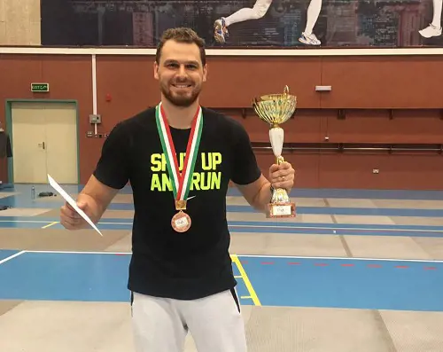 Karim Kamoun poses with the Ramadan fencing Tournament trophy on June 17, 2017