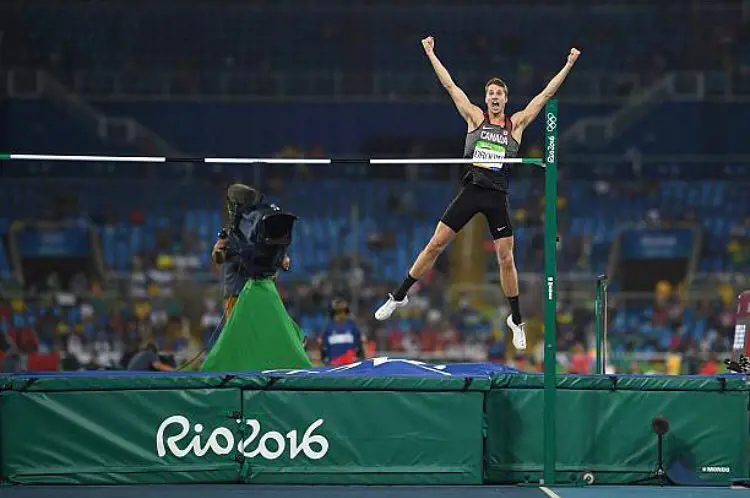 Derek Drouin celebrates in the Rio De Janeiro Olympics as he takes home the gold medal