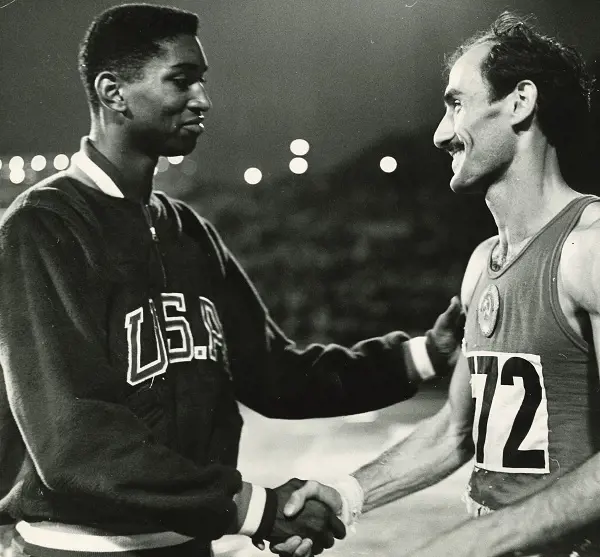 John Thomas greets his competitor before the games begins in the 1960s 