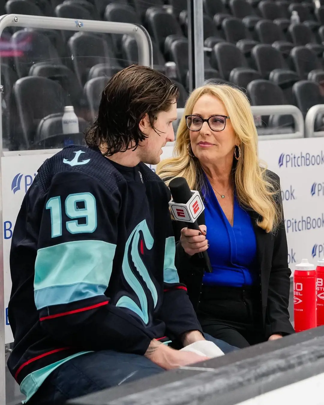Linda interviewing ice hockey player Jared McCann at Climate Pledge Arena on April 8, 2023.