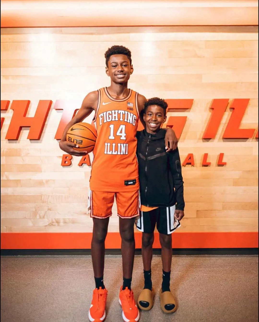 Kanon (Left) sporting Fighting Illini's 14 number jersey in June 2022