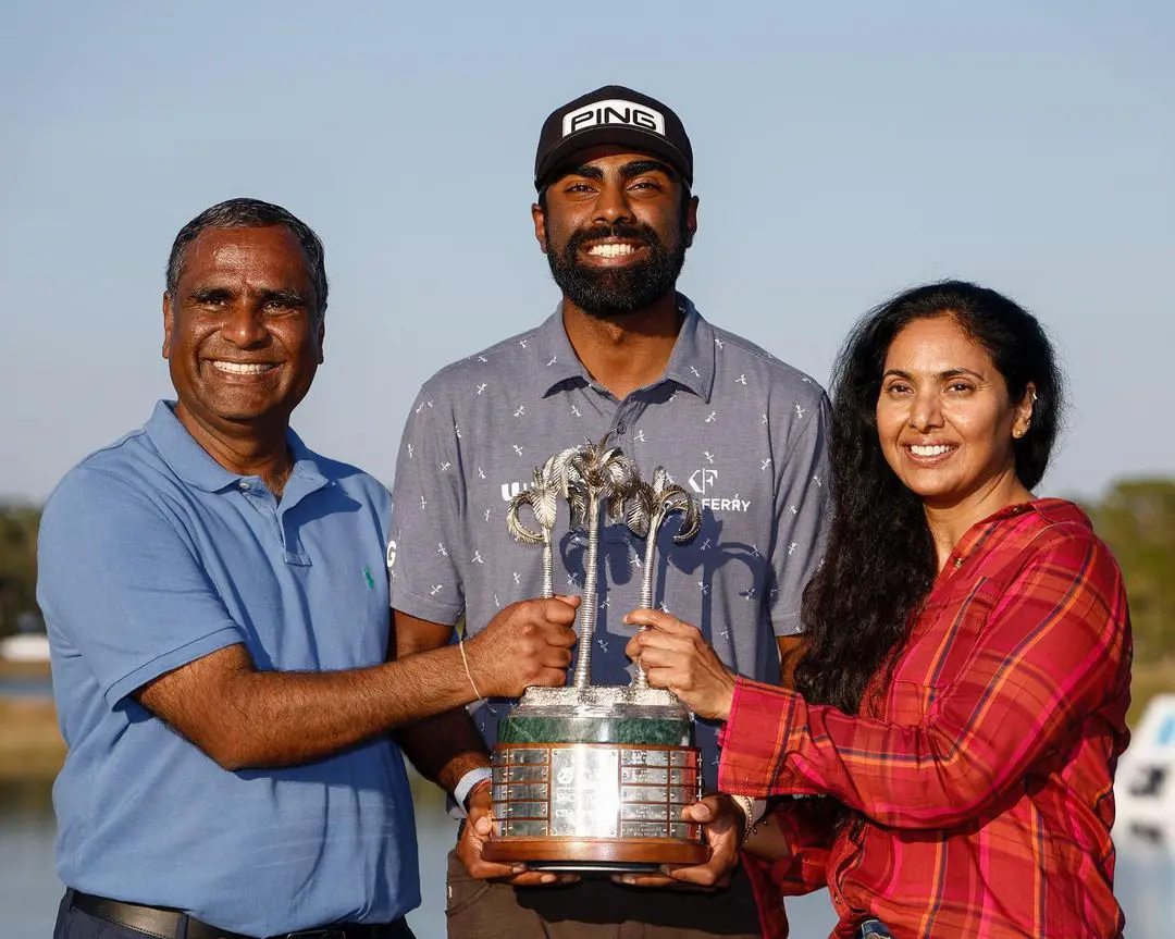 Sahith celebrating his win at QBE Shootout on December 11, 2022, with his birth givers at Tiburón Golf Club.