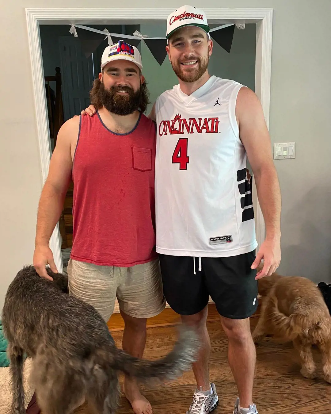 Travis and Jason playing with their dogs at their childhood home in May 2020