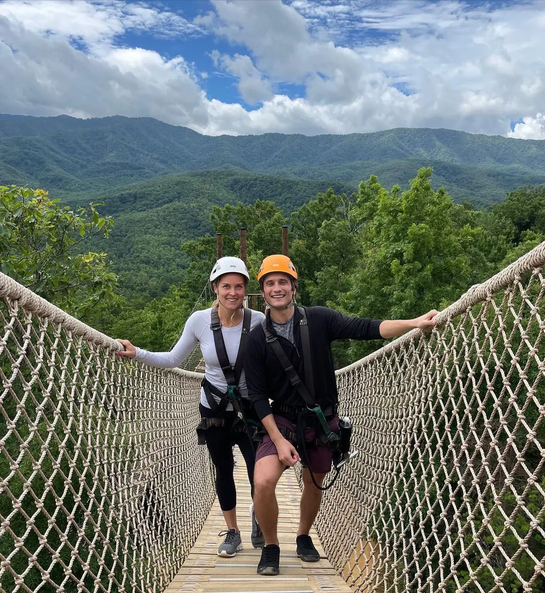 Shelby Rogers John Slavs up for a mountain climbing near Chimney Tops Trail in July 2021