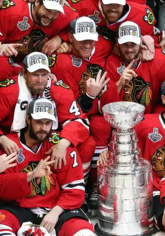 The Blackhawks roster celebrating their victorious moment together.