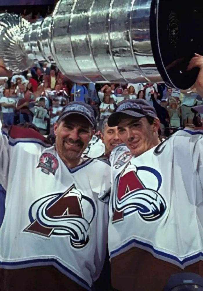 Joe Sakic(right) and Ray Bourque(left) holding the 2001 trophy.