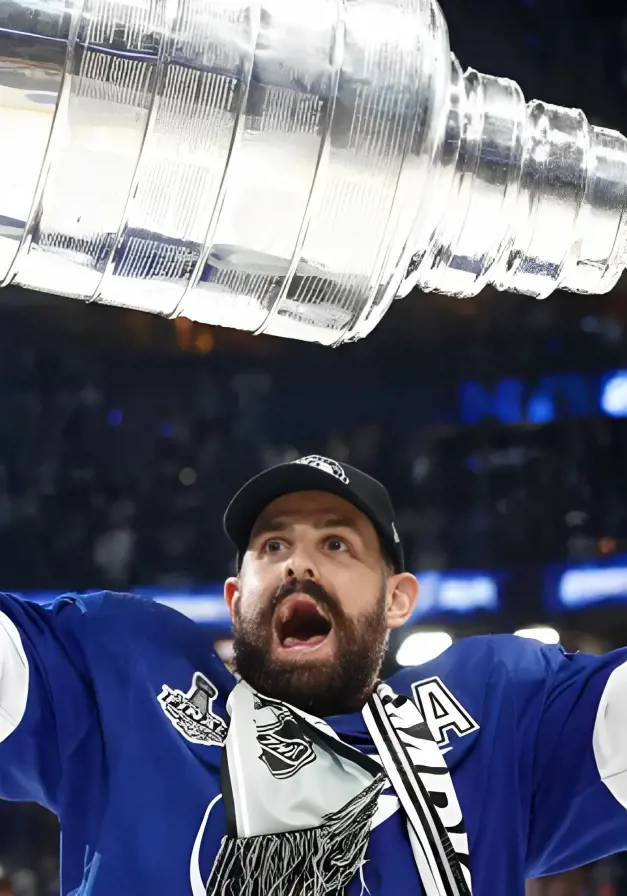 Left winger Alex Killorn looks jubilant while lifting the 2021 Trophy.